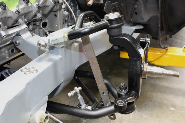 Broad lower A-arm increases load capacity and stability during braking and cornering. The lower A-arm's length reduces track-width change and roll-center movement during suspension travel for smoother transitions entering and exiting turns.