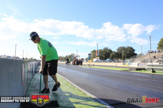 The track crew swept the entire starting line area to rid of dirt and other debris. Here Edward Lynn is doin work.